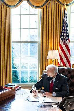 President Joe Biden signs the 'Ghost Army Congressional Gold Medal Act,' Tuesday, February 1, 2022, in the Oval Office. (Official White House Photo by Adam Schultz)